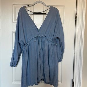 Beautiful light blue mini dress perfect for summer. Deep v in front and back